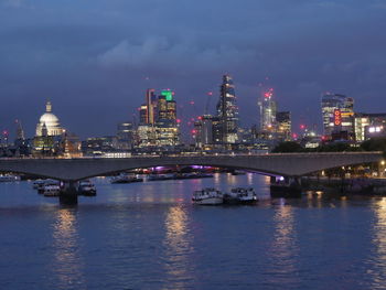 Illuminated city at waterfront