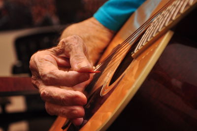 Cropped image of guitarist playing guitar