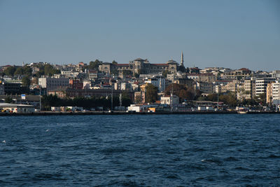 City by sea against sky