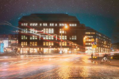 Illuminated buildings in city at night