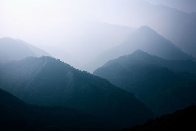 Scenic view of mountains against sky during winter