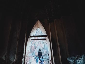 Low angle view of old window in abandoned building