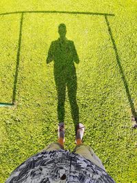 Low section of man standing on paving stone