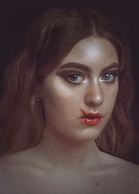 Close-up portrait of beautiful young woman over black background