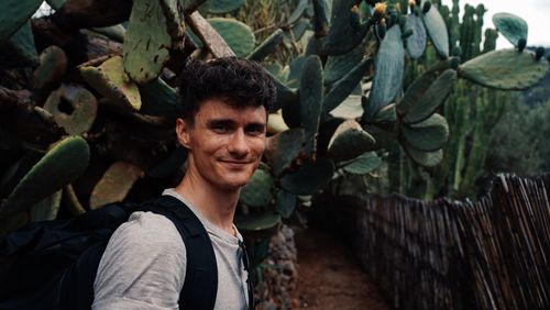 Portrait of smiling young man outdoors