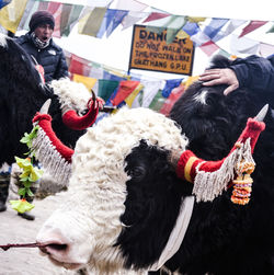 Close-up of people at market stall