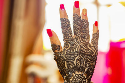 Indian bride's hand painted with henna