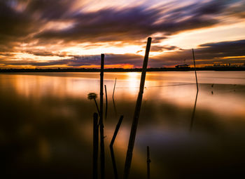 Scenic view of lake against sky during sunset