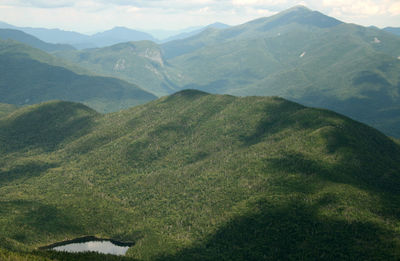 Scenic view of landscape against cloudy sky