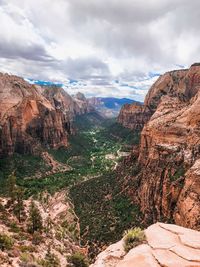 Scenic view of mountain against cloudy sky