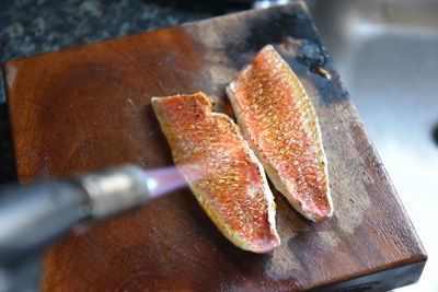 High angle view of bread on cutting board