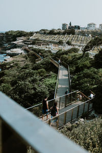 People standing on footbridge