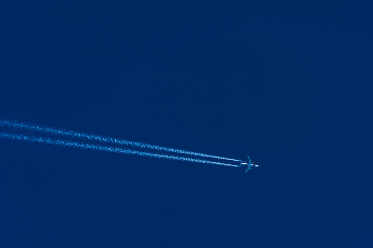 LOW ANGLE VIEW OF AIRPLANE FLYING IN SKY