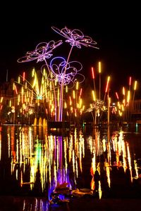Firework display in city at night