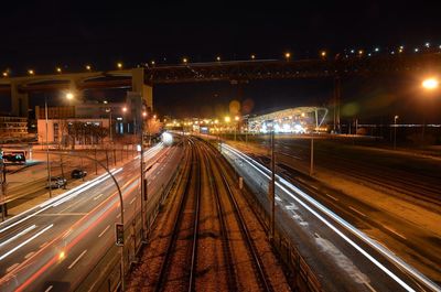 High angle view of light trails on railroad tracks at night