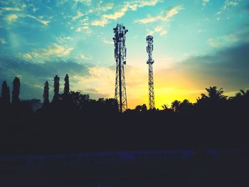 Trees against sky at sunset