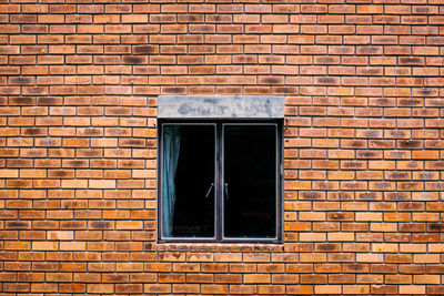 Window on brick wall of building