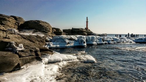 View of frozen beach against sky