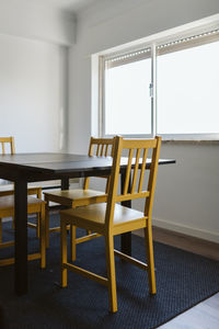 Empty chairs and table at home