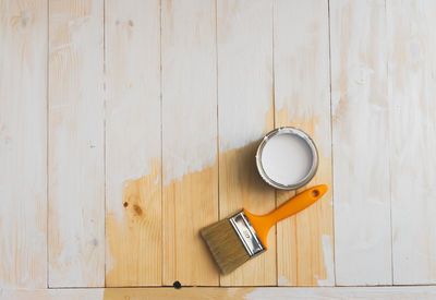 High angle view of coffee cup on table against wall at home