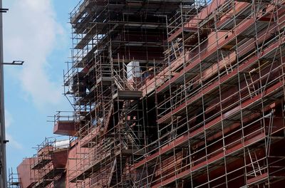 Scaffolding on a warship under construction in a shipyard.