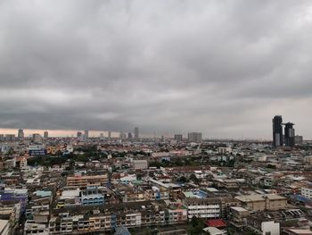High angle view of buildings in city against sky