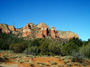 Rock formations against blue sky