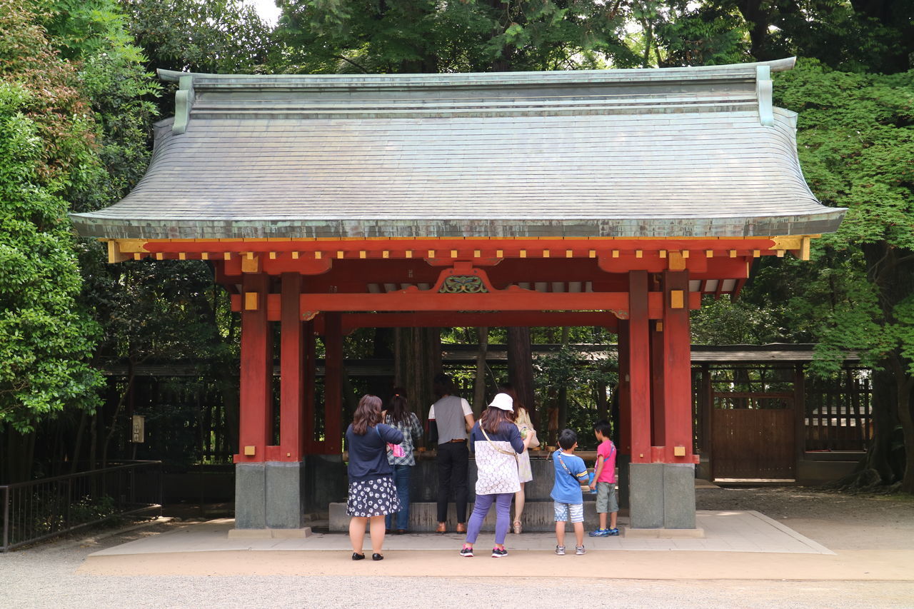 PEOPLE AT ENTRANCE OF BUILDING