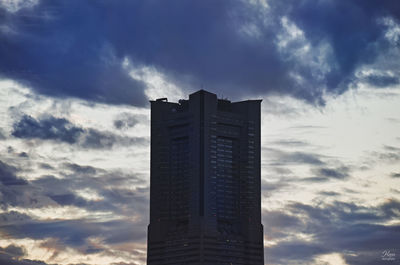 Low angle view of buildings against sky during sunset