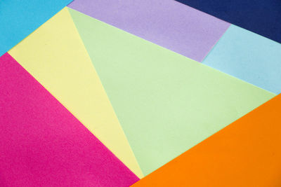 High angle view of multi colored paper on table