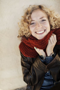 Portrait of woman wearing red scarf