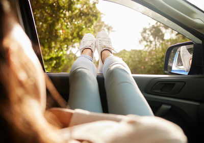 Low section of woman in car