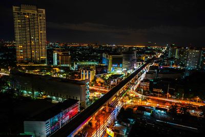 High angle view of illuminated buildings in city at night