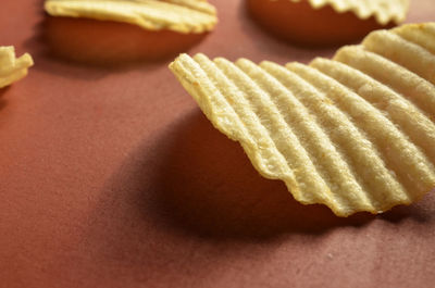 Close-up of potato chips on table