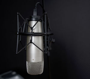 Close-up of coin-operated binoculars against sky