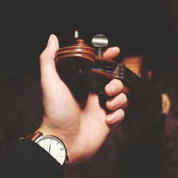 Close-up of hand holding violin