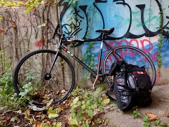 Bicycle parked against wall