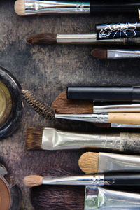 High angle view of make-up brushes on table