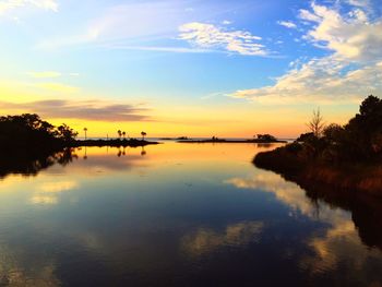 Scenic view of lake against sky during sunset