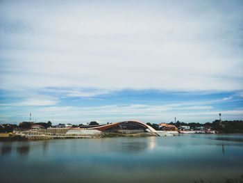 Bridge over river with buildings in background