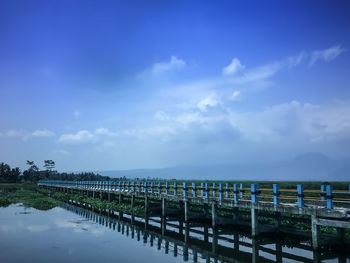 Pier over sea against sky