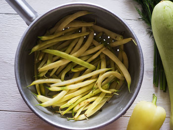 High angle view of chopped vegetables in bowl on table