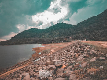 Aerial view of lake and mountains against sky
