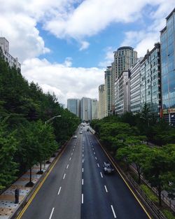 Road in city against sky