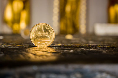 Close-up of coins on table