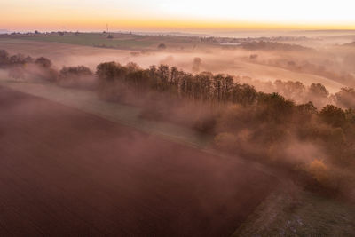 Scenic view of landscape against sky during sunset