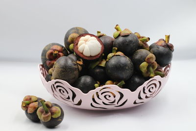 Close-up of fruits in plate on table