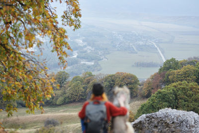 Rear view of people looking at mountain