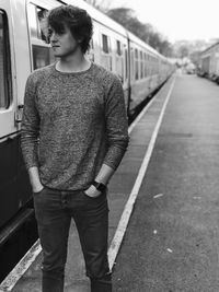 Man standing on railroad track