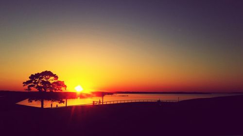 Scenic view of beach against sky during sunset